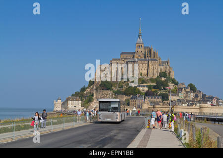 The new shuttle bus arrives at Mont St Michel Stock Photo