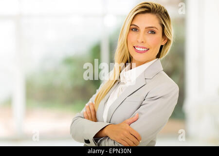 beautiful young blond woman looking at the camera Stock Photo