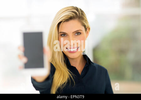 happy young woman holding smart phone Stock Photo