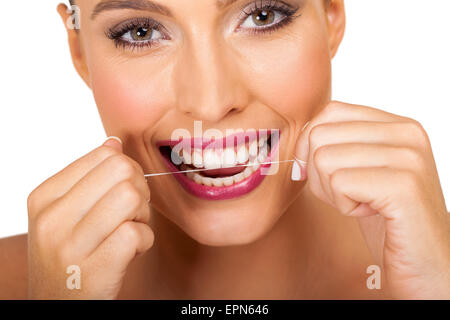 beautiful young woman using dental floss Stock Photo