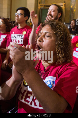 Los Angeles, USA. 19th May, 2015. Supporters cheer and applaud as the Los Angeles City Council votes to raise the minimum wage in the city to 15 dollars an hour by 2020, in Los Angeles, the United States, May 19, 2015. The council voted in favor of raising the minimum wage. Credit:  Zhao Hanrong/Xinhua/Alamy Live News Stock Photo