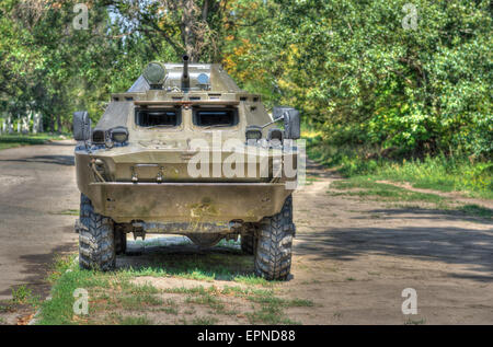 An old Soviet Armored troop-carrier on the street (Hdr). Stock Photo