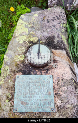 Revd Walker's 'Clipping Stone' now used as a sundial at Holy Trinity Church, Seathwaite, Dunnerdale, Lake District, Cumbria Stock Photo