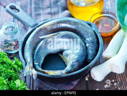 raw fish with salt and spice in the pan Stock Photo