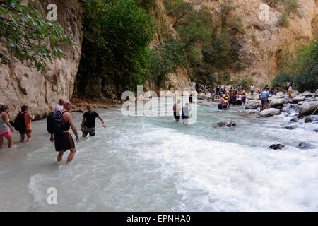 Visitors crossing the river on their out of Saklikent Gorge, Turkey Stock Photo