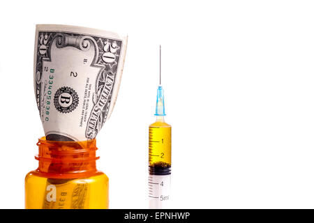 Money in a prescription Medicin Bottle. Both Prescription and Drugs cost a lot of money Stock Photo