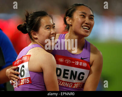 (150520) -- BEIJING, May 20, 2015(Xinhua) -- Wu Shuijiao (L) of China celebrates with her teammate Deng Ru after Women's 100m Hurdles Final of 2015 IAAF World Challenge at National Stadium (Birds Nest) in Beijing, China on May 20, 2015. Wu claimed the tile with 12.85 seconds.(Xinhua/Wang Lili) Stock Photo