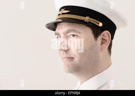 Portrait of man in pilot hat looking away. Stock Photo