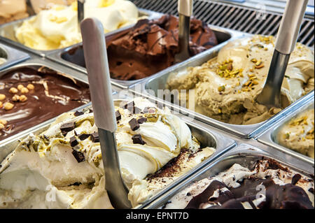 Close up of trays of different ice cream in assorted flavors displayed in a store window Stock Photo