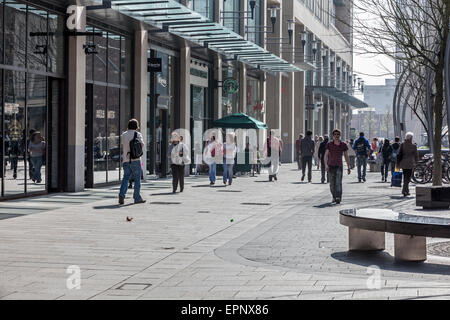 Shoppers strolling in the sunshine along The Hayes in Cardiff City Centre Stock Photo