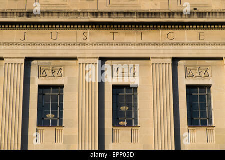 WASHINGTON DC, United States — The southern facade of the Robert F. Kennedy Department of Justice Building faces Constitution Avenue. The neoclassical structure, completed in 1935, serves as the headquarters of the United States Department of Justice. The building's exterior features distinctive Art Deco elements and sculptural details. Stock Photo