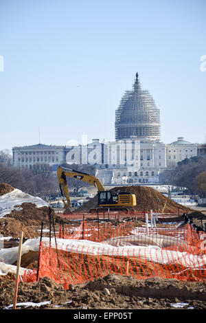 WASHINGTON DC, United States — Renovations on a section of the eastern end of the National Mall in Washington DC, with the dome of the U.S. Capitol Building in the background covered in scaffolding as it undergoes its own repairs. Stock Photo