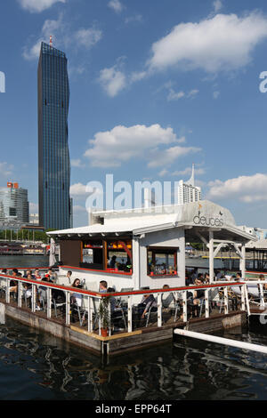 DC (Donau City) Tower, Vienna, Austria with a bar located on an island in the river Danube. Stock Photo