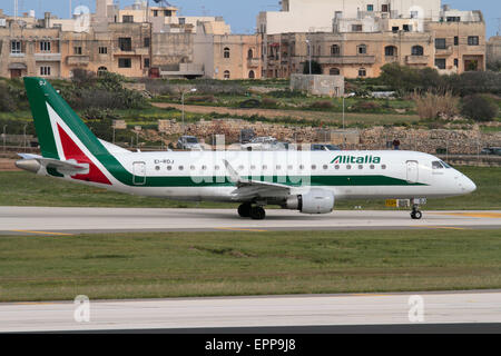 Alitalia Embraer 175 regional jet airliner taxiing for departure from Malta Stock Photo