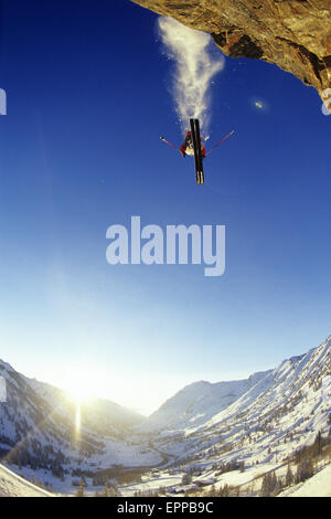 Man skiing off a cliff in Alta, Utah Stock Photo