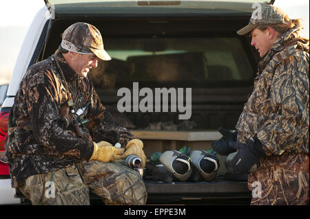 Two smiling hunters Stock Photo - Alamy