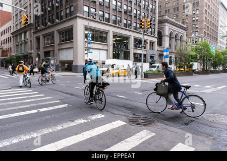 Bicyclists commuting during the New York morning rush hour. Stock Photo