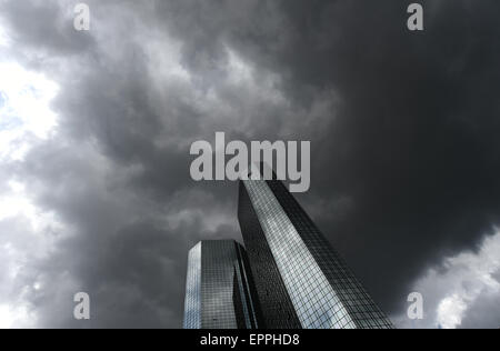 Frankfurt, Germany. 20th May, 2015. Dark clouds hover over the headquarters of German banking and financial services corporation Deutsche Bank in Frankfurt, Germany, 20 May 2015. The company has scheduled its stockholders' meeting for 21 May. PHOTO: ARNE DEDERT/dpa/Alamy Live News Stock Photo