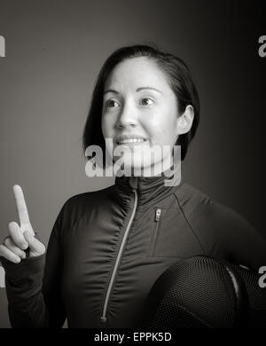 Female fencer pointing her finger up Stock Photo