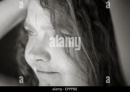 Model in studio isolated on plain grey background Stock Photo