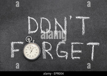 don’t forget phrase handwritten on chalkboard with vintage precise stopwatch used instead of O Stock Photo