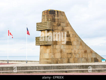 A large stone monument on Omaha Beach, Normandy, France commemorates one of the most important sites of the 6th June 1944 D-Day. Stock Photo
