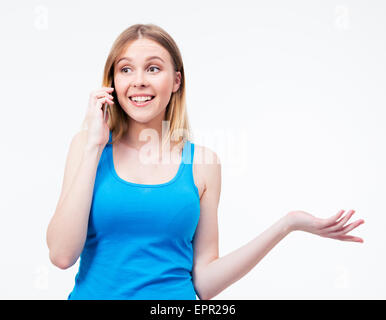 Cheerful woman talking on the phone isolated on a white background. Looking away Stock Photo