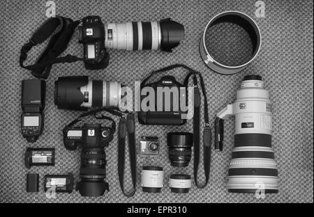 Professional Canon Photographic equipment including Camera bodies and a selection of lenses and accessories. Stock Photo