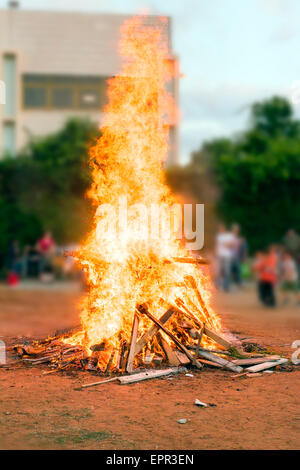 A blazing bonfire lit to Celebrate the Jewish holiday of Lag Baomer Stock Photo