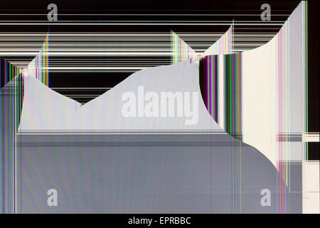The LCD screen of the monitor is broken by shots from the traumatic gun. Color strips and pixels the abstract background Stock Photo
