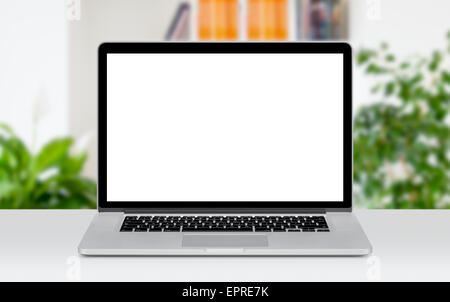 Front view of modern laptop mockup with white blank screen on the office desk. Office space on the background. Stock Photo