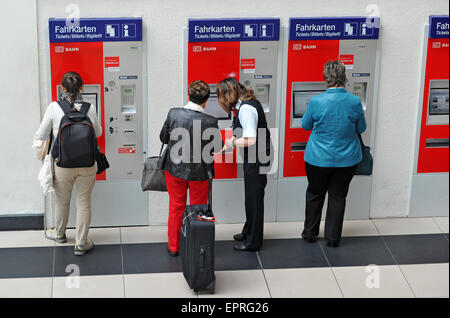 Dresden, Germany. 21st May, 2015. Passengers purchase tickets from ticket machines of German railway operator Deutsche Bahn (DB) in Dresden, Germany, 21 May 2015. The train drivers' union GDL and the Deutsche Bahn have agreed on an end to the strike. Photo: MATTHIAS HIEKEL/dpa/Alamy Live News Stock Photo