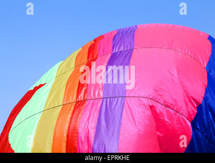 colorful hot air balloon flies in sky blue Stock Photo