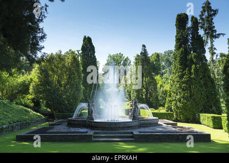 fountain and meadow in a park, spring season Stock Photo