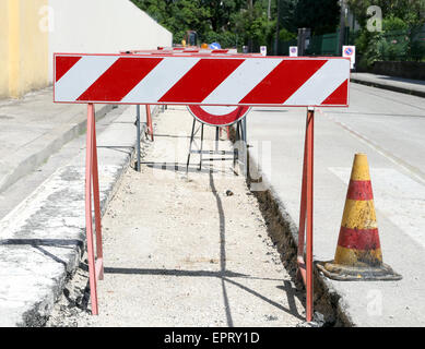 stand excavation protection on the road during the roadworks Stock Photo