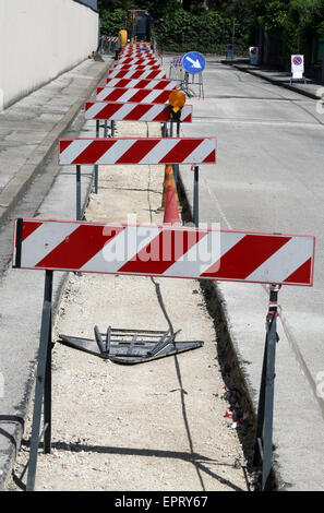 many hurdles in the construction site during the roadworks for the laying power line cables Stock Photo