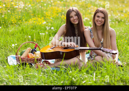 Two beautiful young women on a picnic Stock Photo