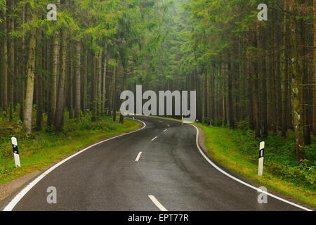 Curving Country Road in Rain, Bavaria, Germany Stock Photo