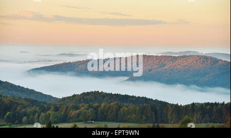 Scenic overview of hills on an early, autumn morning with fog, Bavarian Forest National Park, Bavaria, Germany Stock Photo