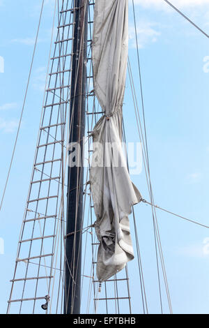 Sails tied down on the mast of a tall ship in the harbour in Toronto Ontario Stock Photo