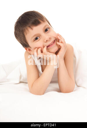 child portrait in white bed Stock Photo