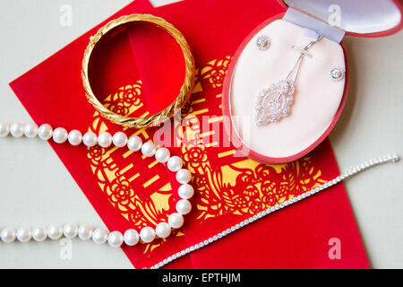 Close-up of Bridal Jewelry and Ang Pow, Studio Shot Stock Photo