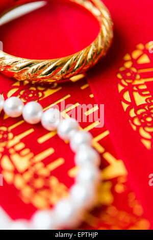 Close-up of Bridal Jewelry and Ang Pow, Studio Shot Stock Photo