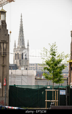 Church and tree with crane and powerline Stock Photo