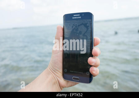 Samsung S6 edge using phone completing final stage setup asking for personal information fingerprint credit information and use Stock Photo