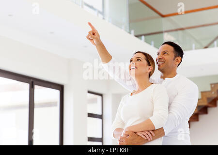 lovely couple looking at their new house Stock Photo