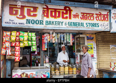 Mumbai India,Dharavi,Shahu Nagar Road,small business,man men male,Muslim,owner,bakery,general store,Hindi English,sign,convenience,India150228041 Stock Photo