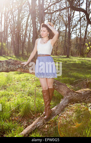 Beautiful young woman enjoying the springtime sunshine outdoors Stock Photo