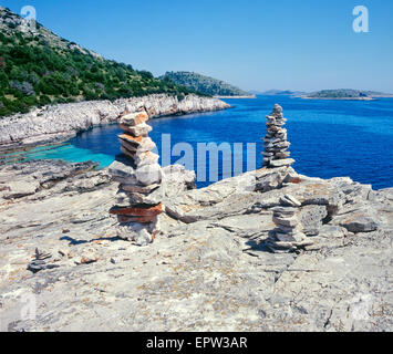 Stone pyramids at National park Kornati Croatia. Stock Photo