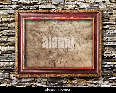 old picture frames with cracked canvas on a brick wall in grunge style Stock Photo